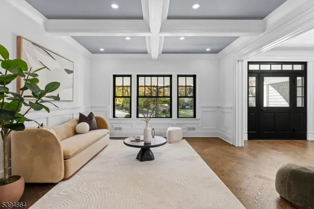 a living room with furniture and window