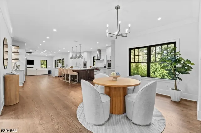 a living room with furniture a window and kitchen view
