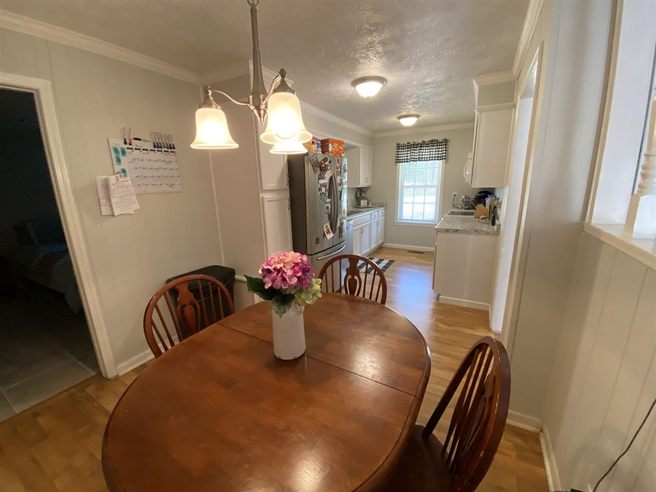 100 Montezuma Road Henderson, TN 38340 - Photo 11 of 20 a view of a dining room with furniture and a chandelier