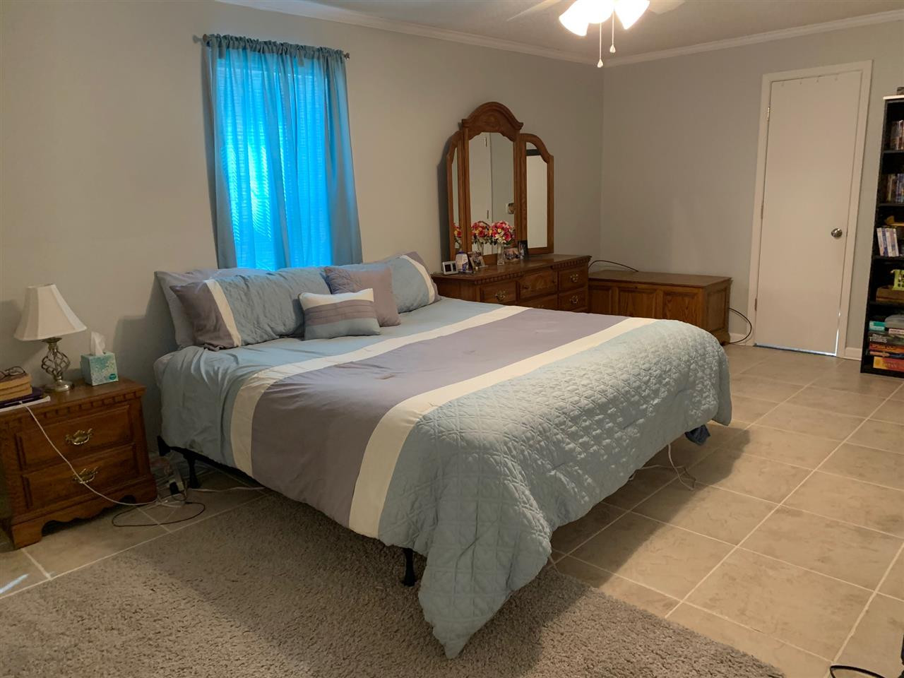 100 Montezuma Road Henderson, TN 38340 - Photo 14 of 20 a bedroom with a bed and a mirror
