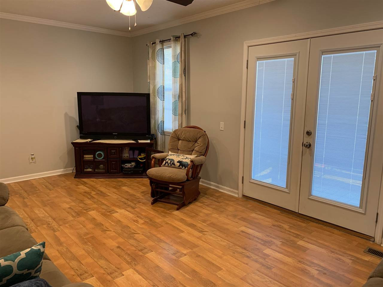 100 Montezuma Road Henderson, TN 38340 - Photo 4 of 20 a living room with furniture and a flat screen tv