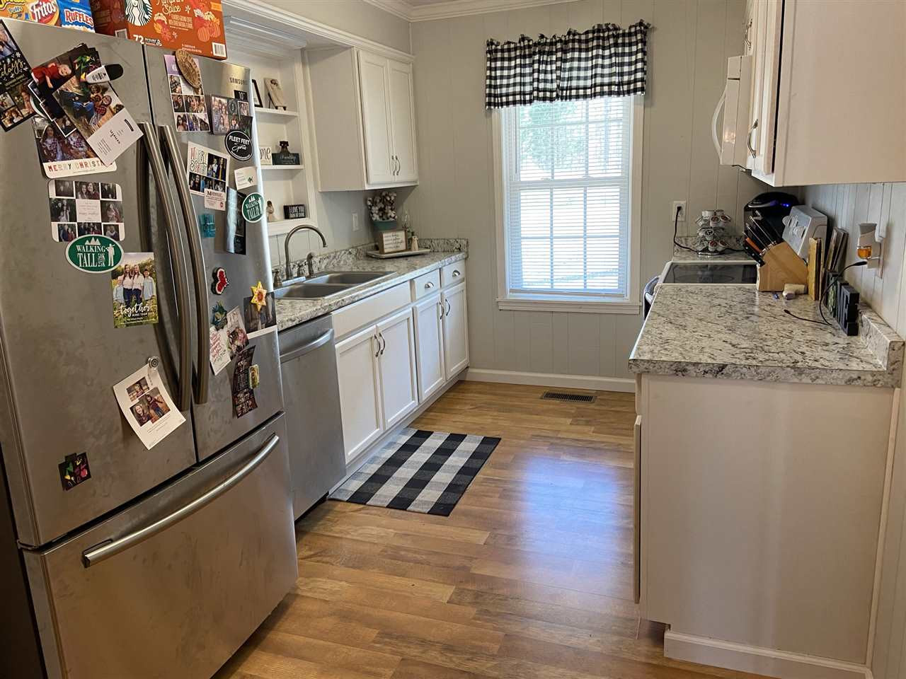 100 Montezuma Road Henderson, TN 38340 - Photo 5 of 20 a kitchen with stainless steel appliances granite countertop a refrigerator and a sink