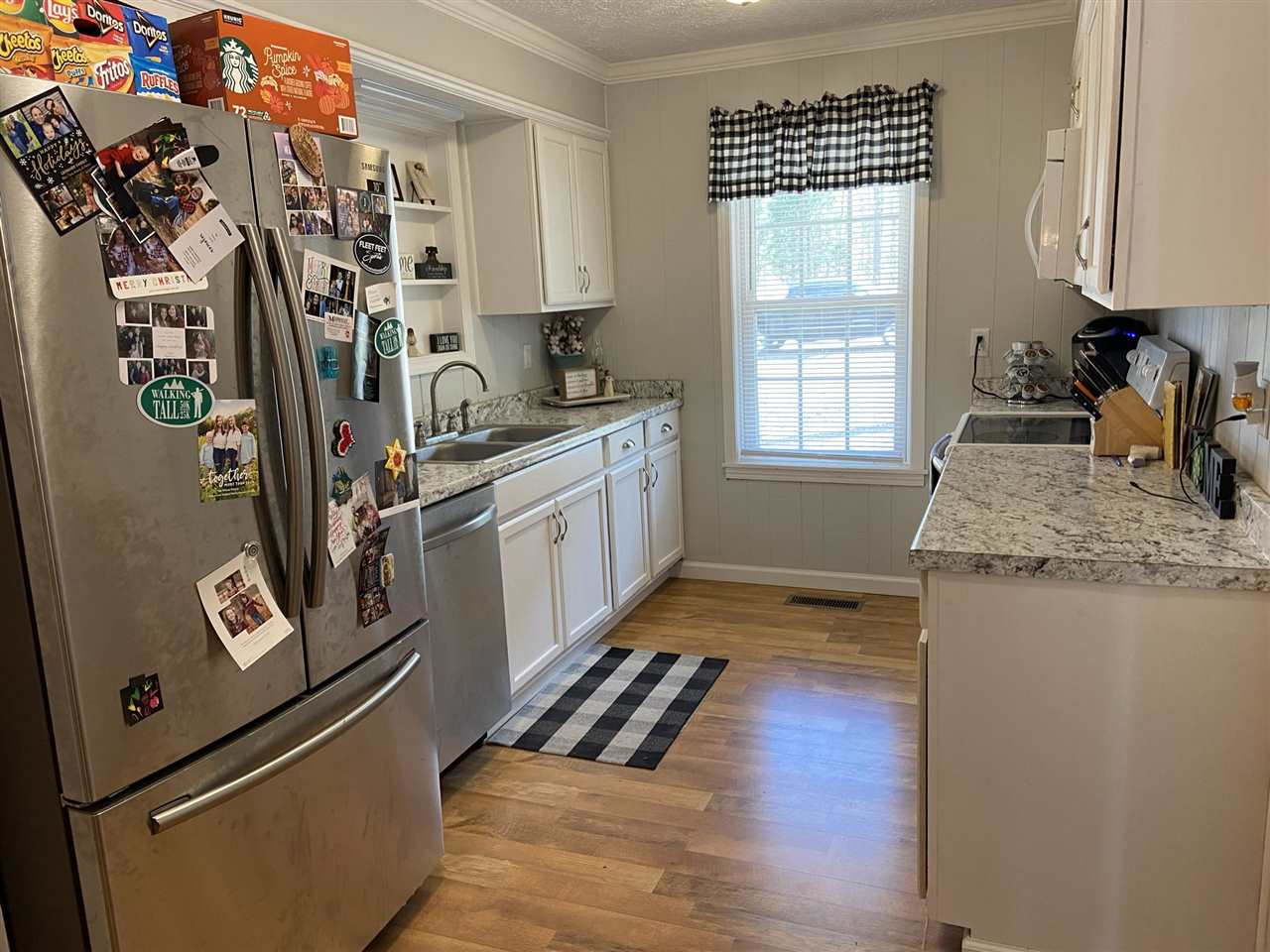 100 Montezuma Road Henderson, TN 38340 - Photo 6 of 20 a kitchen with stainless steel appliances granite countertop a refrigerator and a sink