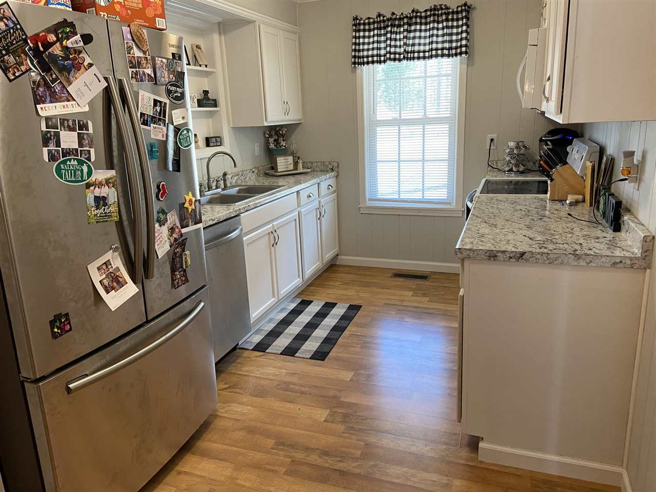100 Montezuma Road Henderson, TN 38340 - Photo 7 of 20 a kitchen with stainless steel appliances granite countertop a refrigerator and a sink
