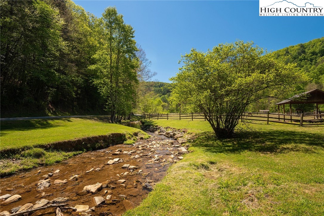 75 Rodeo Road Ferguson, NC 28624 - Photo 14 of 14 a view of a swimming pool with a yard