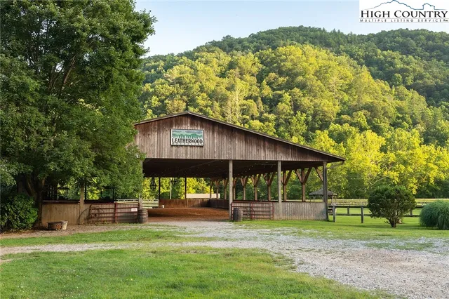 a view of a house with a yard balcony and sitting area