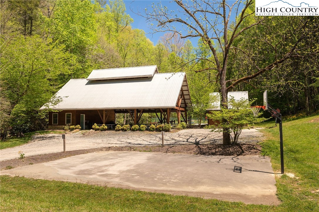 75 Rodeo Road Ferguson, NC 28624 - Photo 9 of 14 a building with trees in front of it
