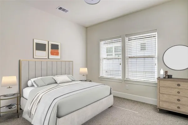 a bedroom with a bed and a dresser
