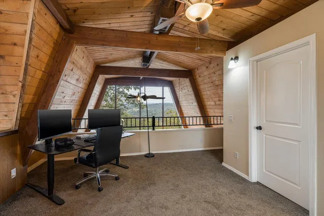 a view of a livingroom with a couch and a piano