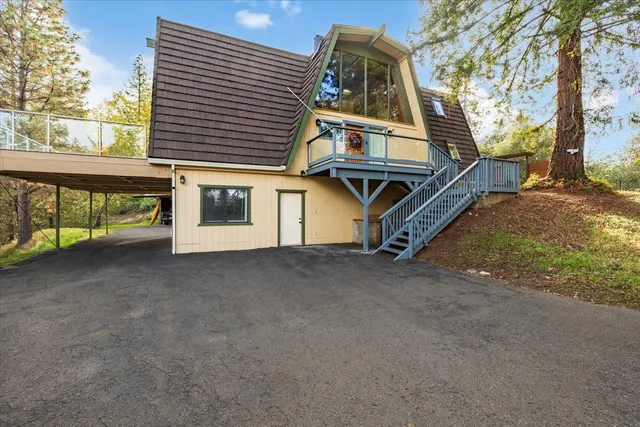 a view of a house with a street