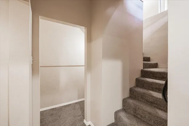 a view of a wooden fence next to a road