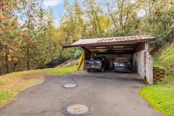 a view of a house with a yard and garage
