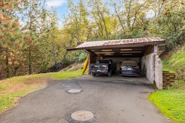 a view of a house with a yard and garage
