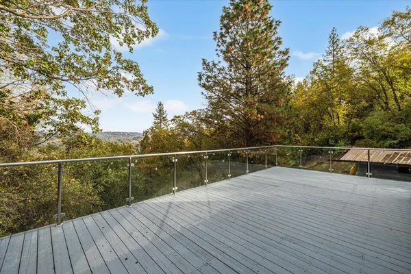 a view of balcony with wooden floor