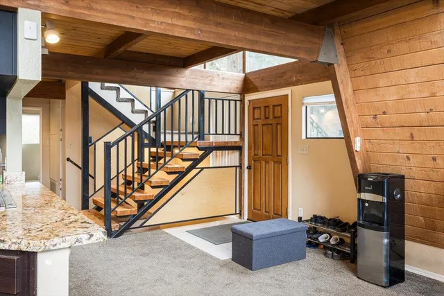 a view of staircase with furniture and stairs