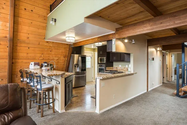 a view of a kitchen with furniture and a kitchen