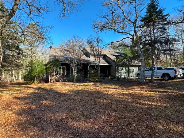 a view of a house with a yard and garage