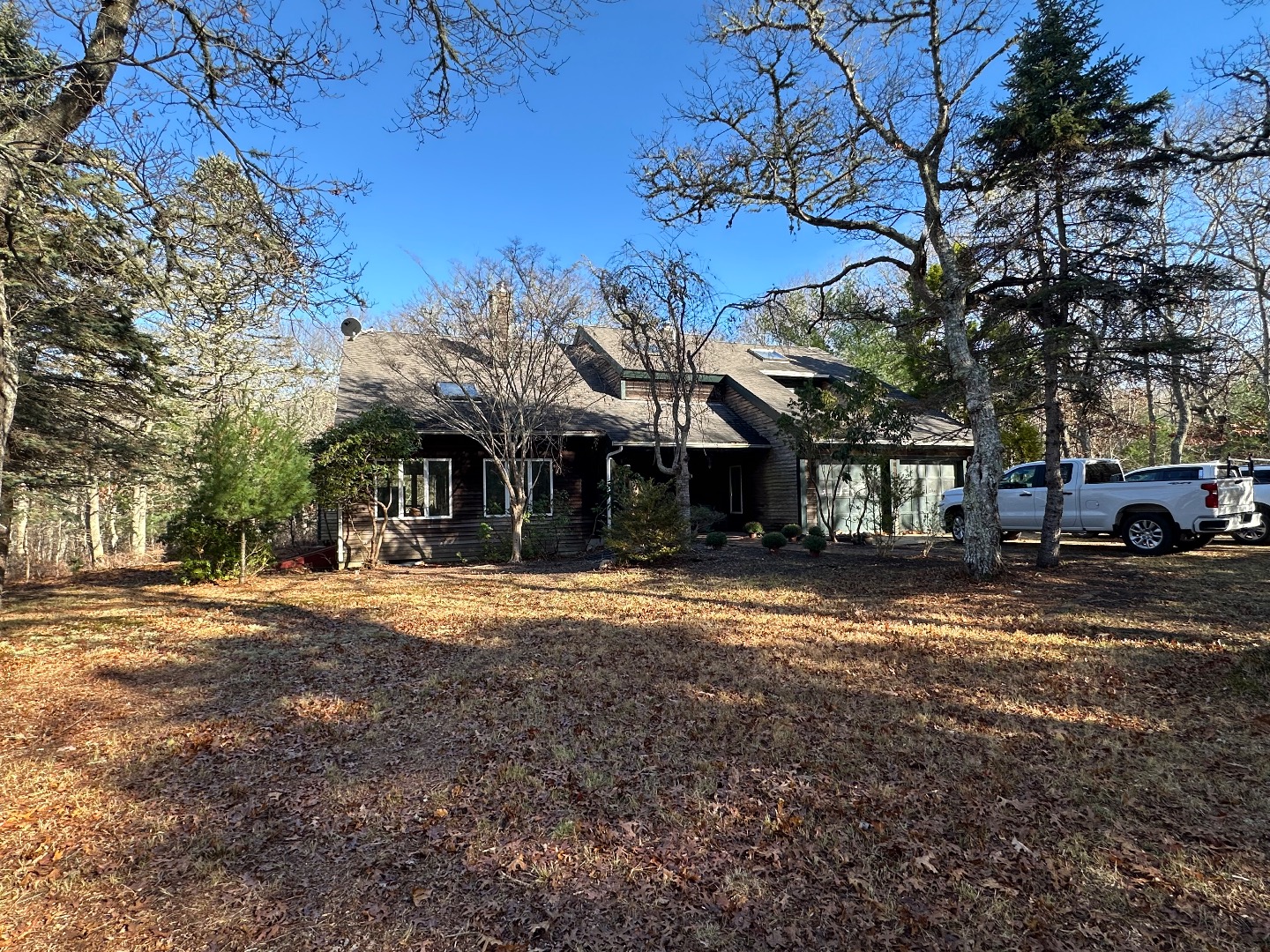 20 Brook Hollow Road West Tisbury, MA 02568 - Photo 2 of 33 a view of a house with a yard and garage