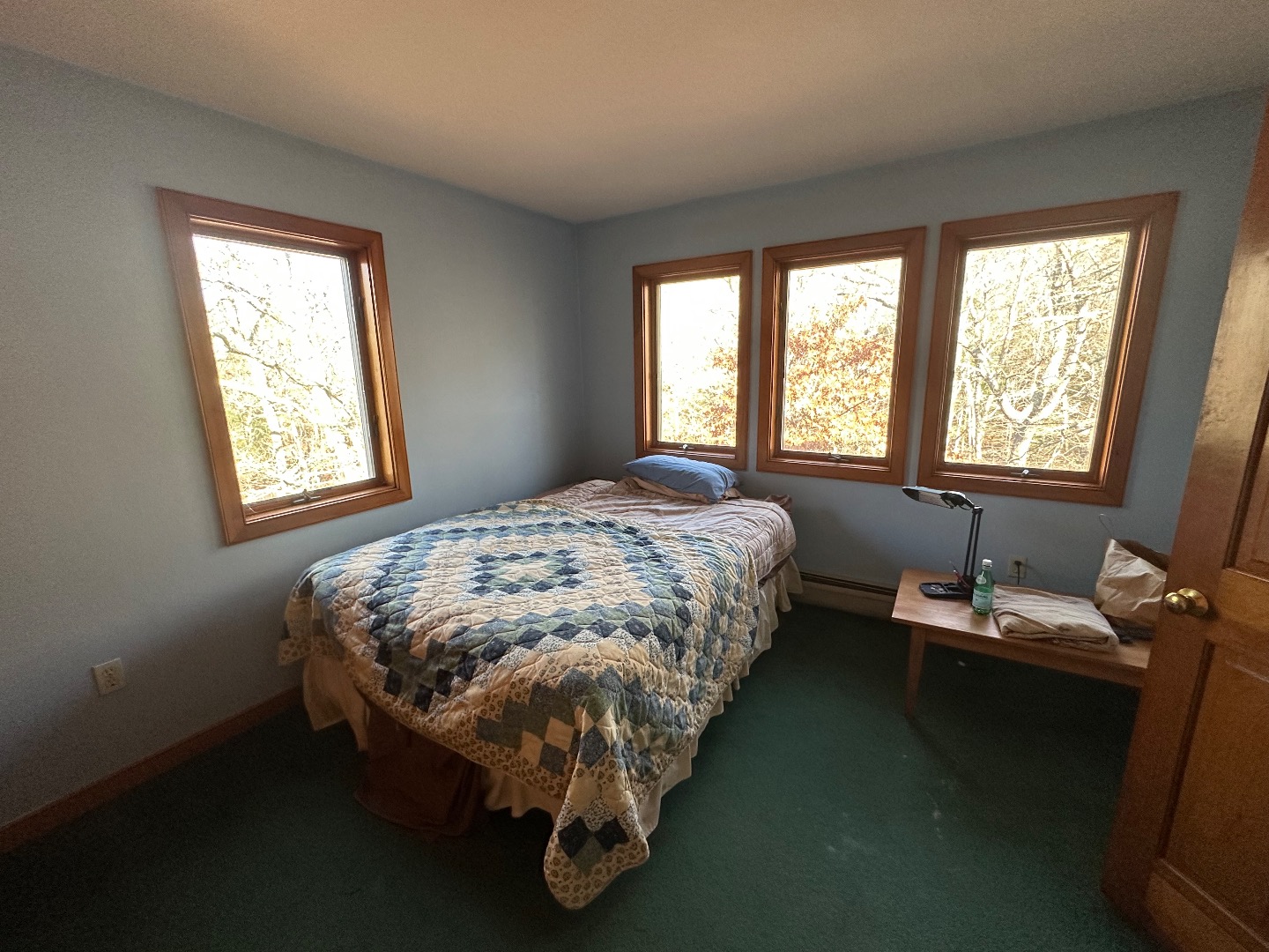 20 Brook Hollow Road West Tisbury, MA 02568 - Photo 28 of 33 a bed sitting in a bedroom next to a window