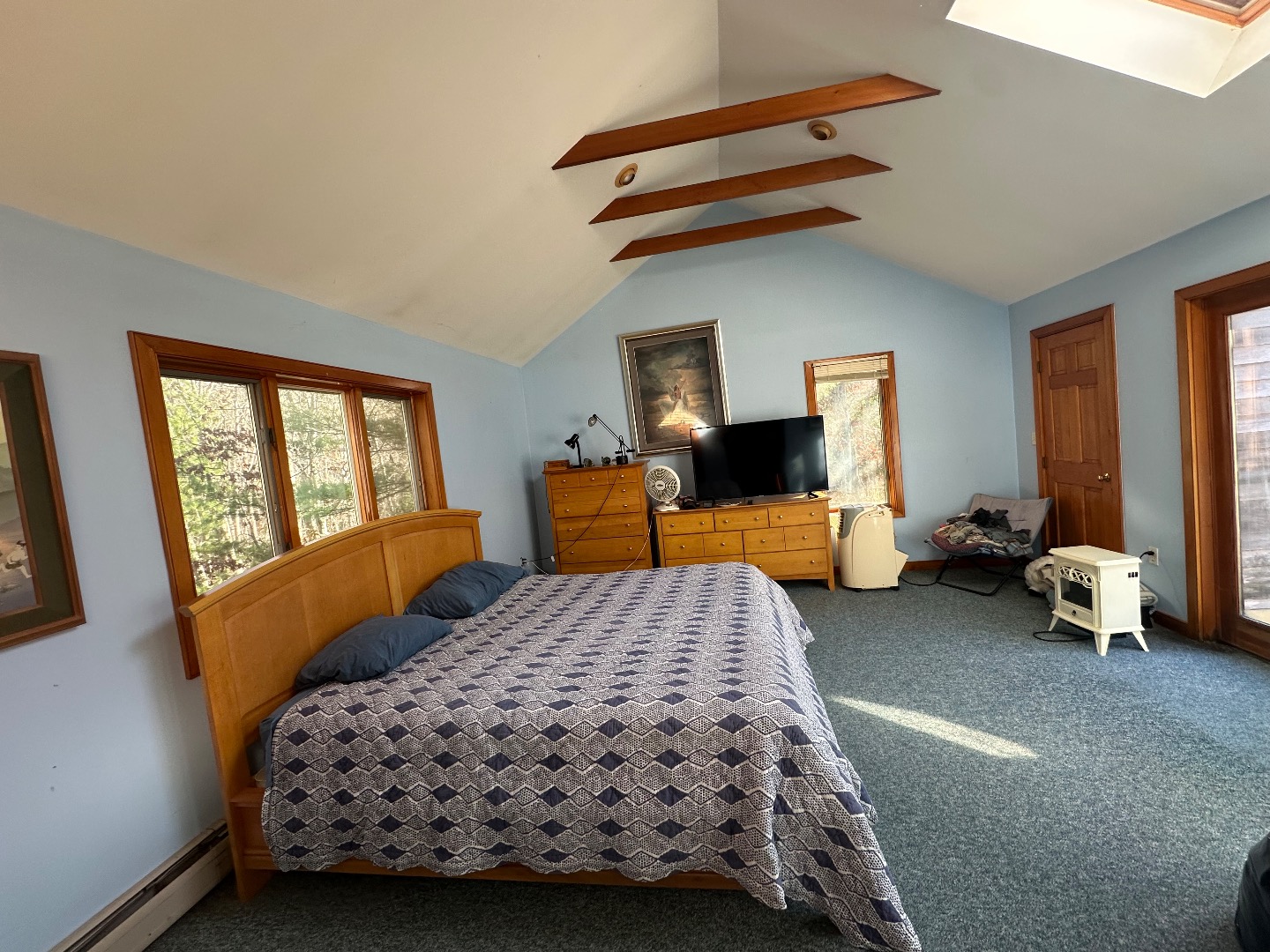 20 Brook Hollow Road West Tisbury, MA 02568 - Photo 29 of 33 a bedroom with a bed and wooden floor