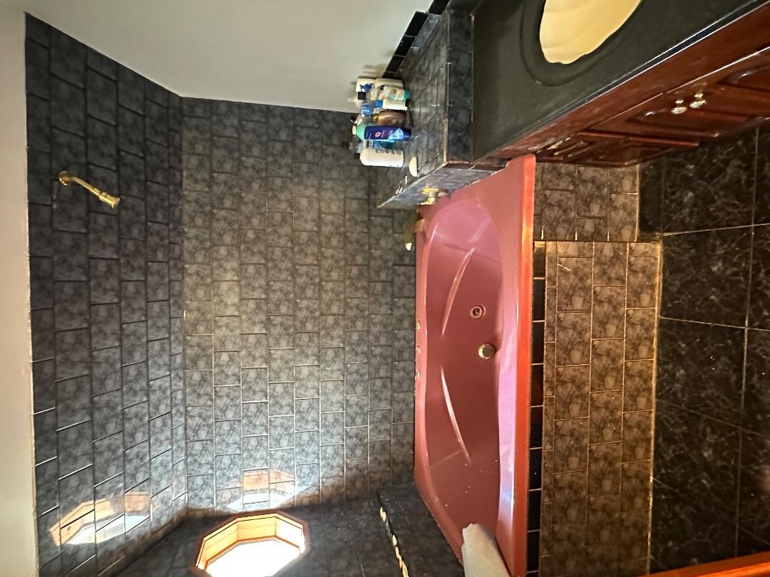 20 Brook Hollow Road West Tisbury, MA 02568 - Photo 32 of 33 a bathroom with a sink and a mirror