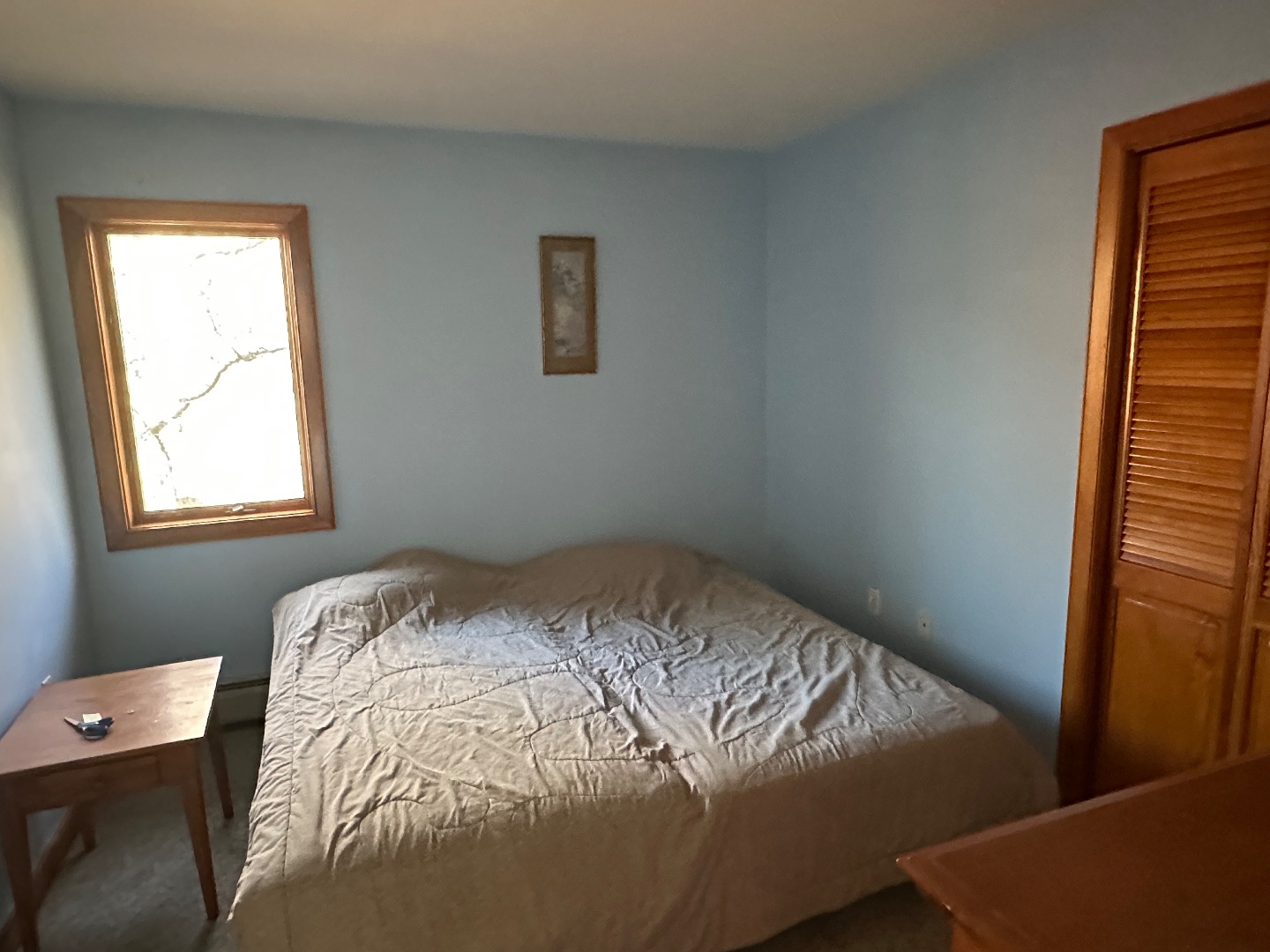 20 Brook Hollow Road West Tisbury, MA 02568 - Photo 33 of 33 a bed sitting in a bedroom next to a window