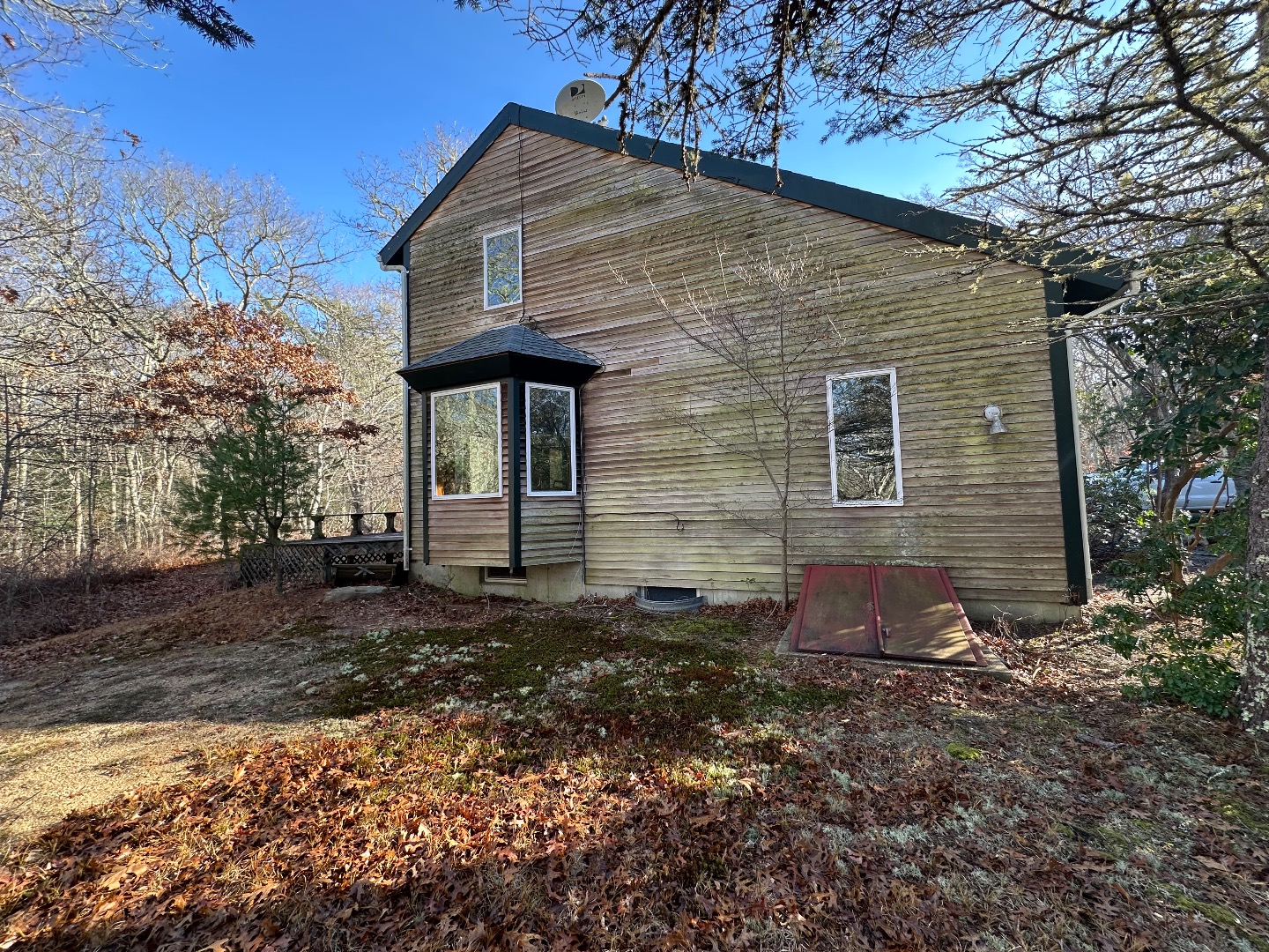 20 Brook Hollow Road West Tisbury, MA 02568 - Photo 5 of 33 a front view of a house with a yard