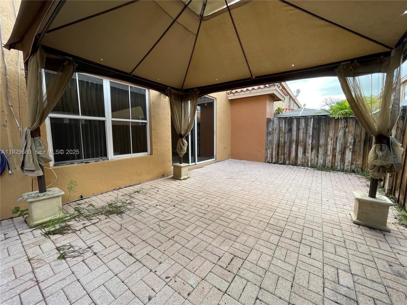 8507 Northwest 140th Terrace, Unit 801 Miami Lakes, FL 33016 - Photo 15 of 42 a view of a backyard of the house