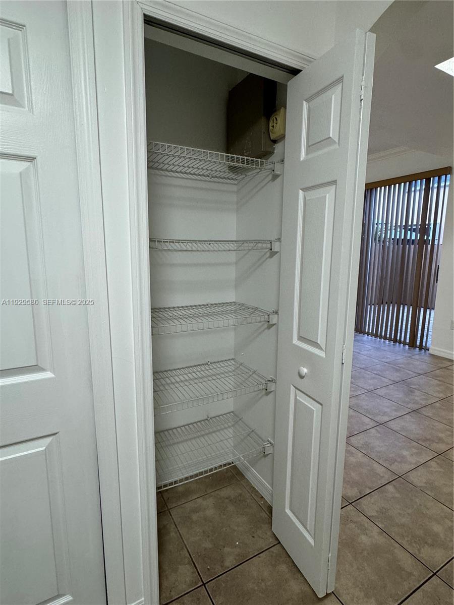 8507 Northwest 140th Terrace, Unit 801 Miami Lakes, FL 33016 - Photo 28 of 42 a view of a walk in closet