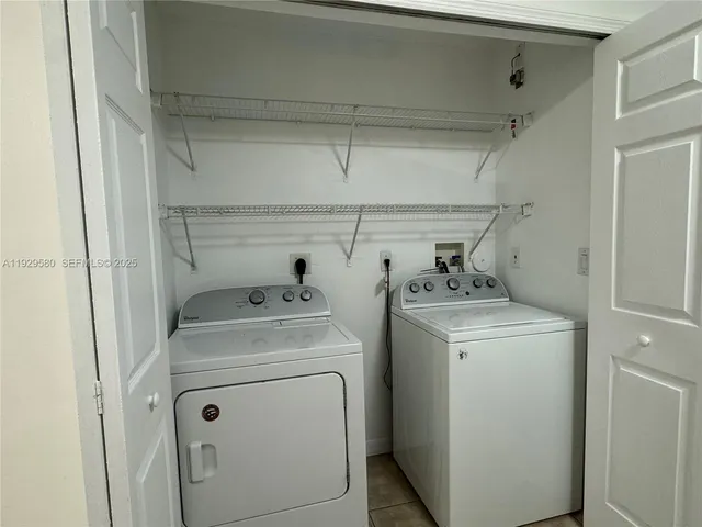 a bathroom with a granite countertop sink a mirror and a bathtub