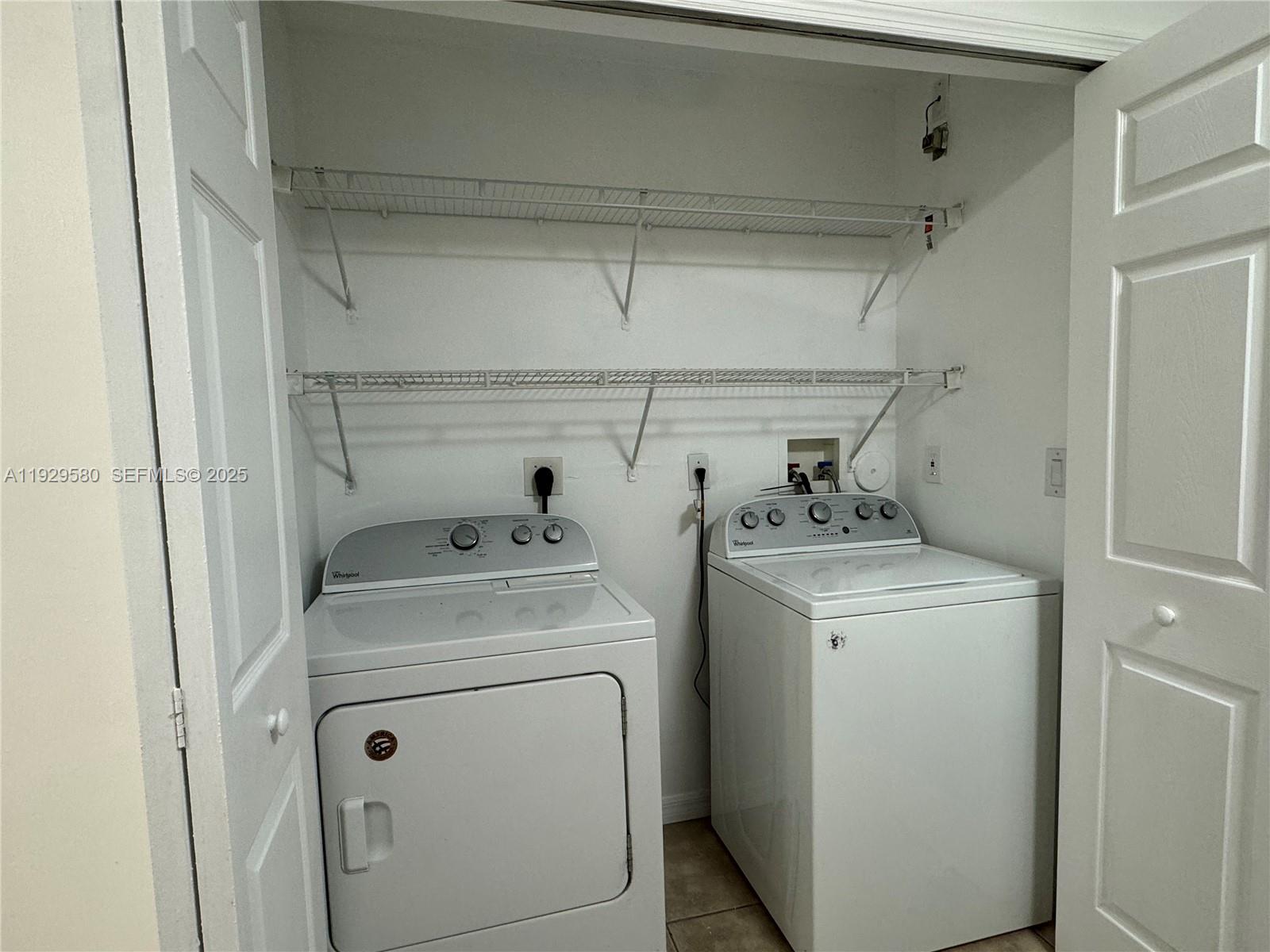 8507 Northwest 140th Terrace, Unit 801 Miami Lakes, FL 33016 - Photo 30 of 42 a utility room with dryer and washer