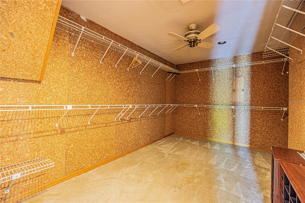 18129 Crawley Road Odessa, FL 33556 - Photo 18 of 38 a bathroom with a window and a shower