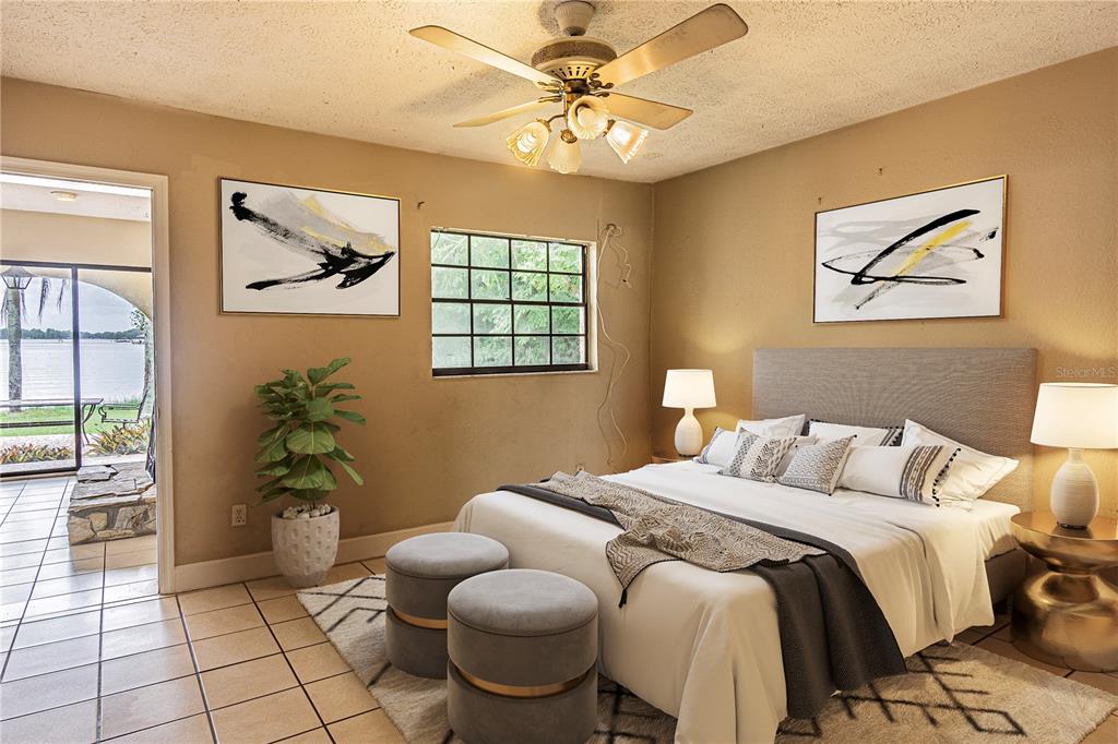 18129 Crawley Road Odessa, FL 33556 - Photo 32 of 38 a bedroom with a bed and a potted plant