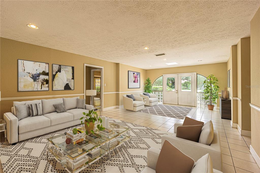 18129 Crawley Road Odessa, FL 33556 - Photo 33 of 38 a living room with furniture and a large window