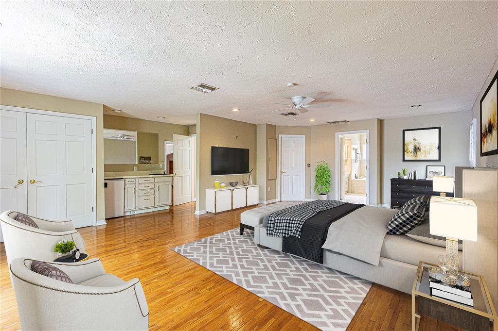 18129 Crawley Road Odessa, FL 33556 - Photo 37 of 38 a living room with furniture and a flat screen tv