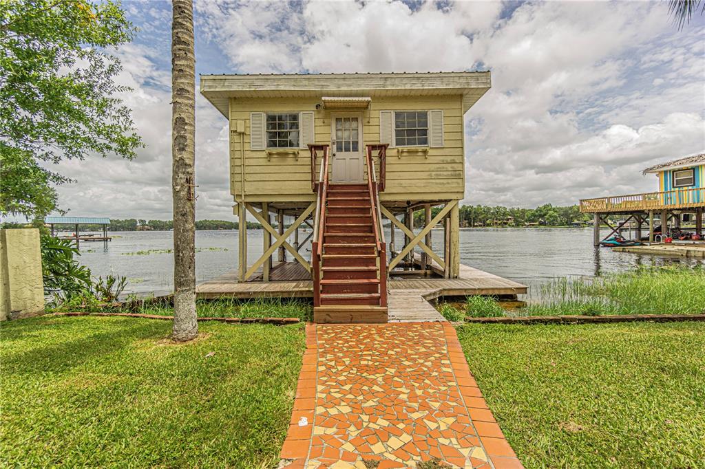 18129 Crawley Road Odessa, FL 33556 - Photo 6 of 38 a front view of a house with swimming pool