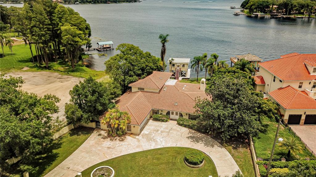 18129 Crawley Road Odessa, FL 33556 - Photo 8 of 38 an aerial view of a house with outdoor space and lake view