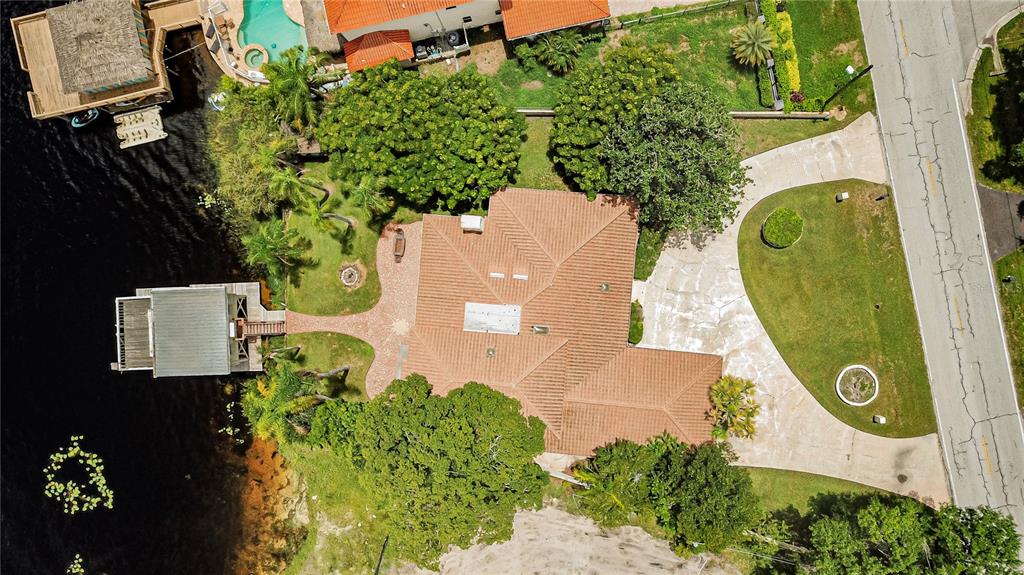 18129 Crawley Road Odessa, FL 33556 - Photo 9 of 38 an aerial view of a house with a swimming pool