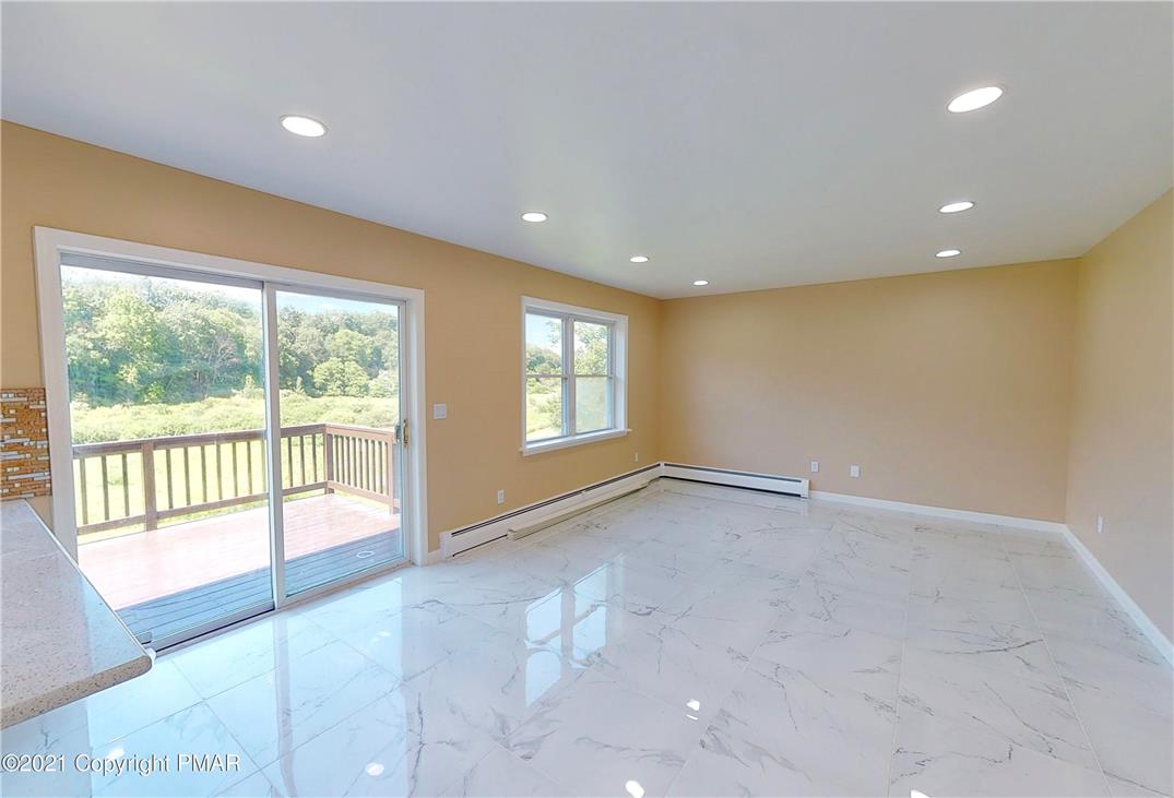 1110 Misty Ridge East Stroudsburg, PA 18302 - Photo 24 of 43 Bright interior living space with expansive views of the natural landscape.