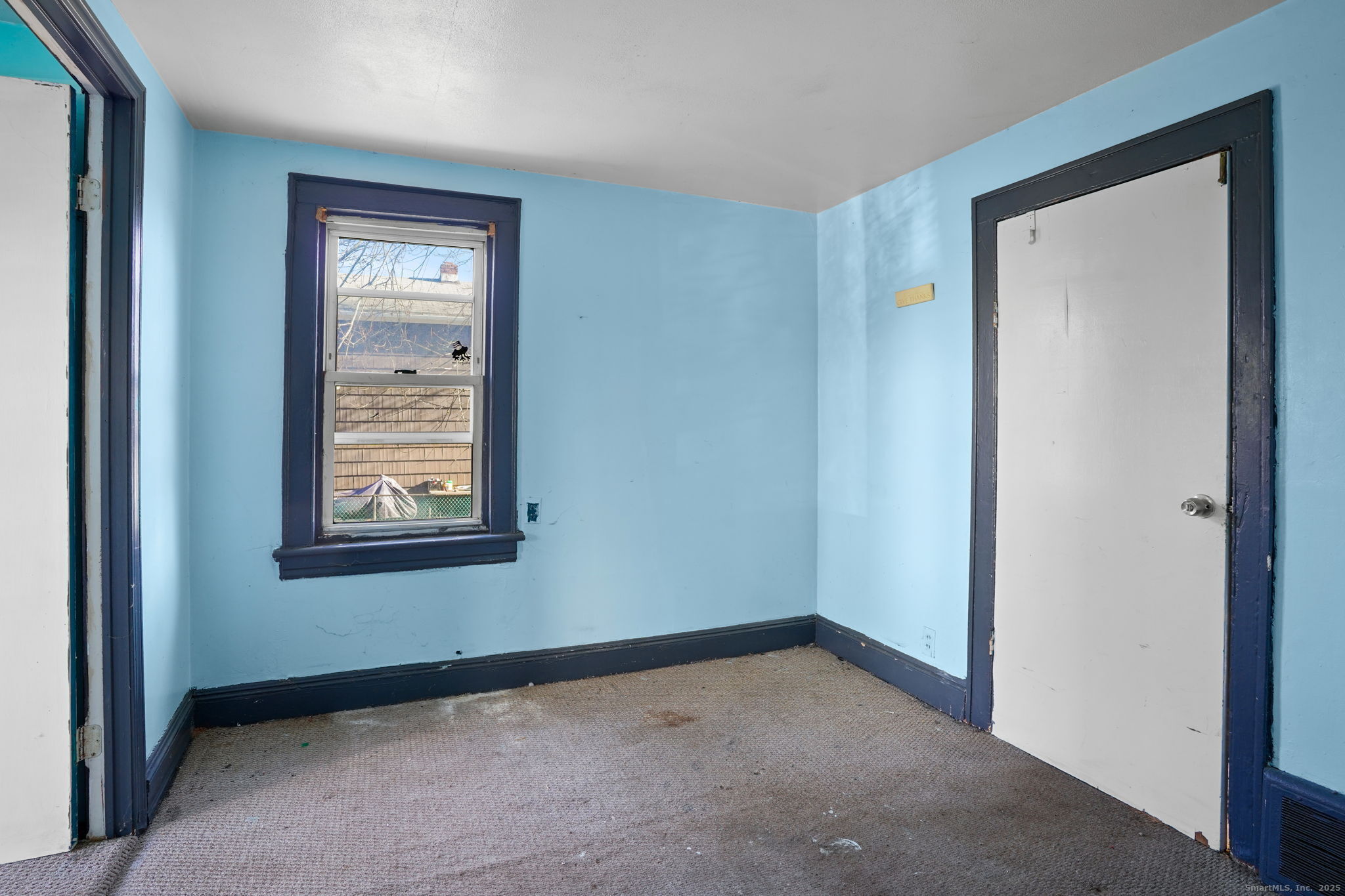 73 Carlson Avenue Bridgeport, CT 06606 - Photo 16 of 29 a view of an empty room with closet and a window