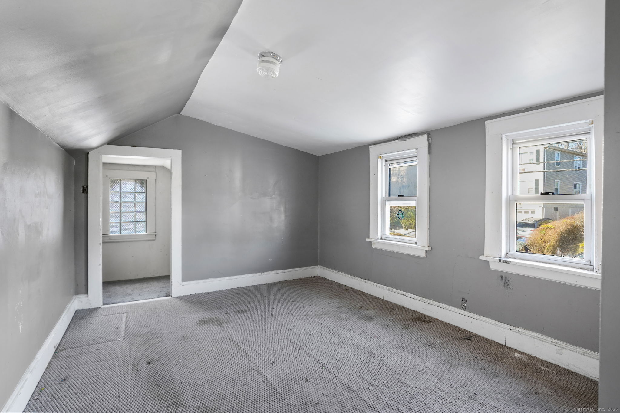 73 Carlson Avenue Bridgeport, CT 06606 - Photo 18 of 29 a view of an empty room with a window