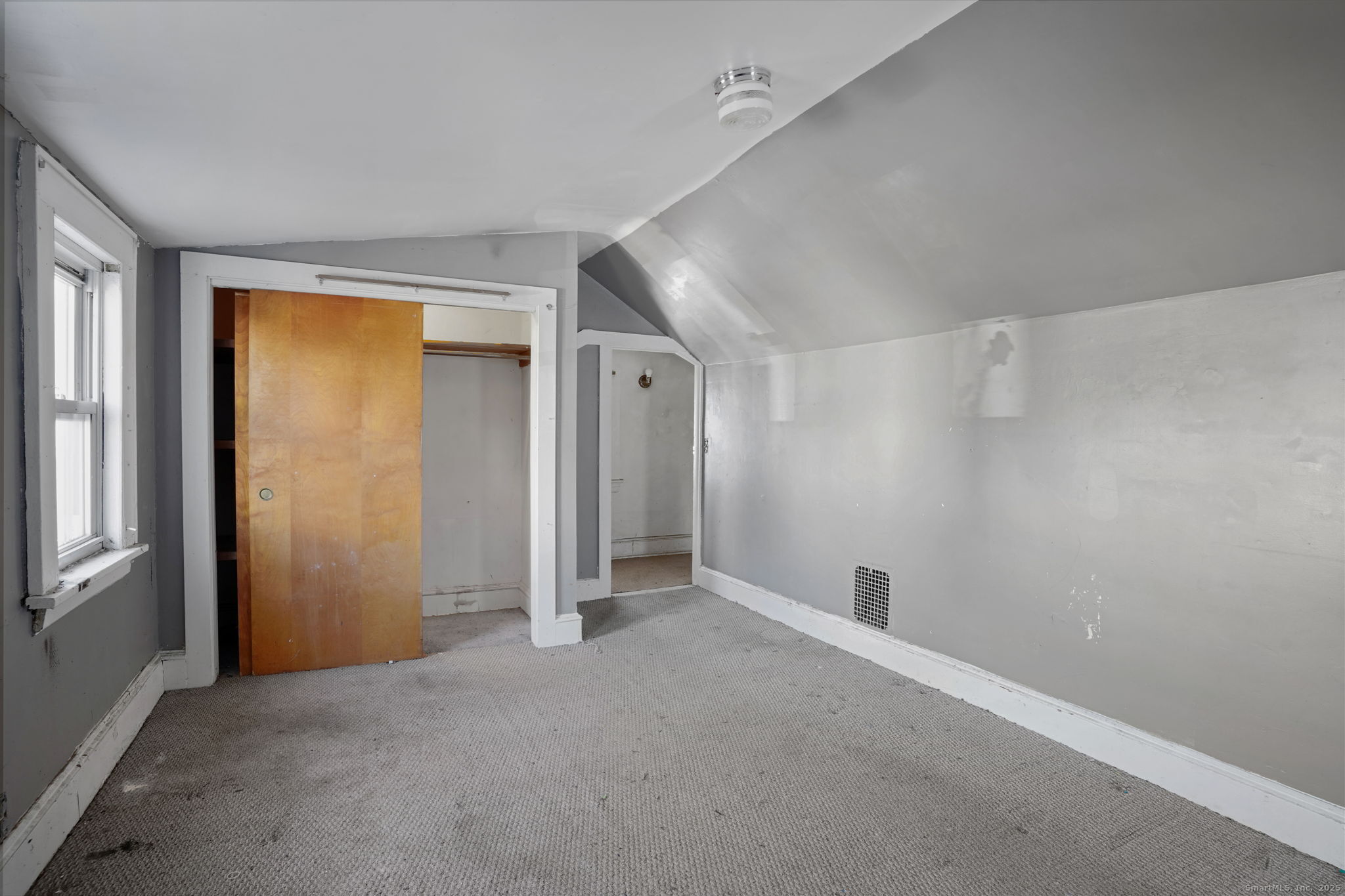 73 Carlson Avenue Bridgeport, CT 06606 - Photo 19 of 29 a view of an empty room with a window