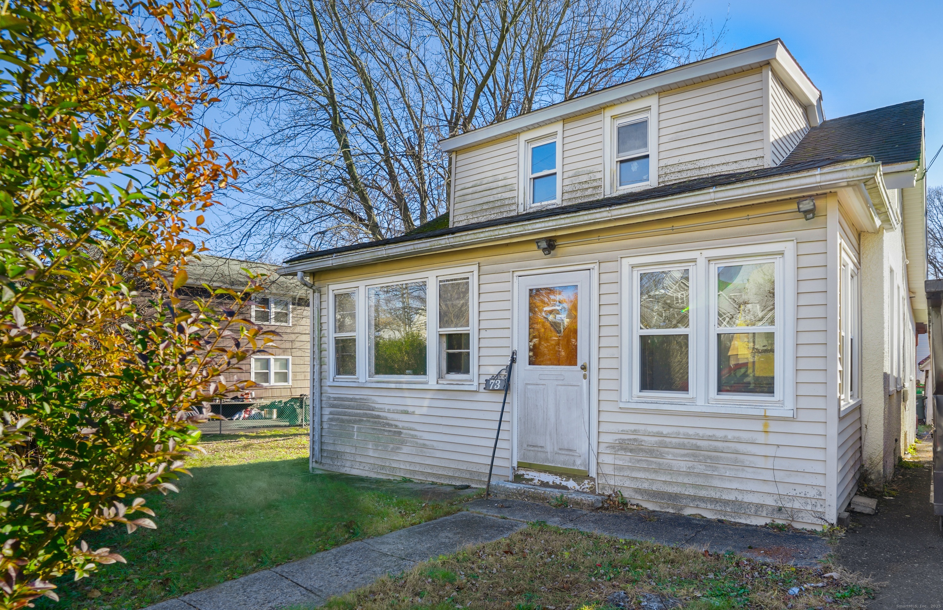73 Carlson Avenue Bridgeport, CT 06606 - Photo 3 of 29 a view of front of a house with a yard