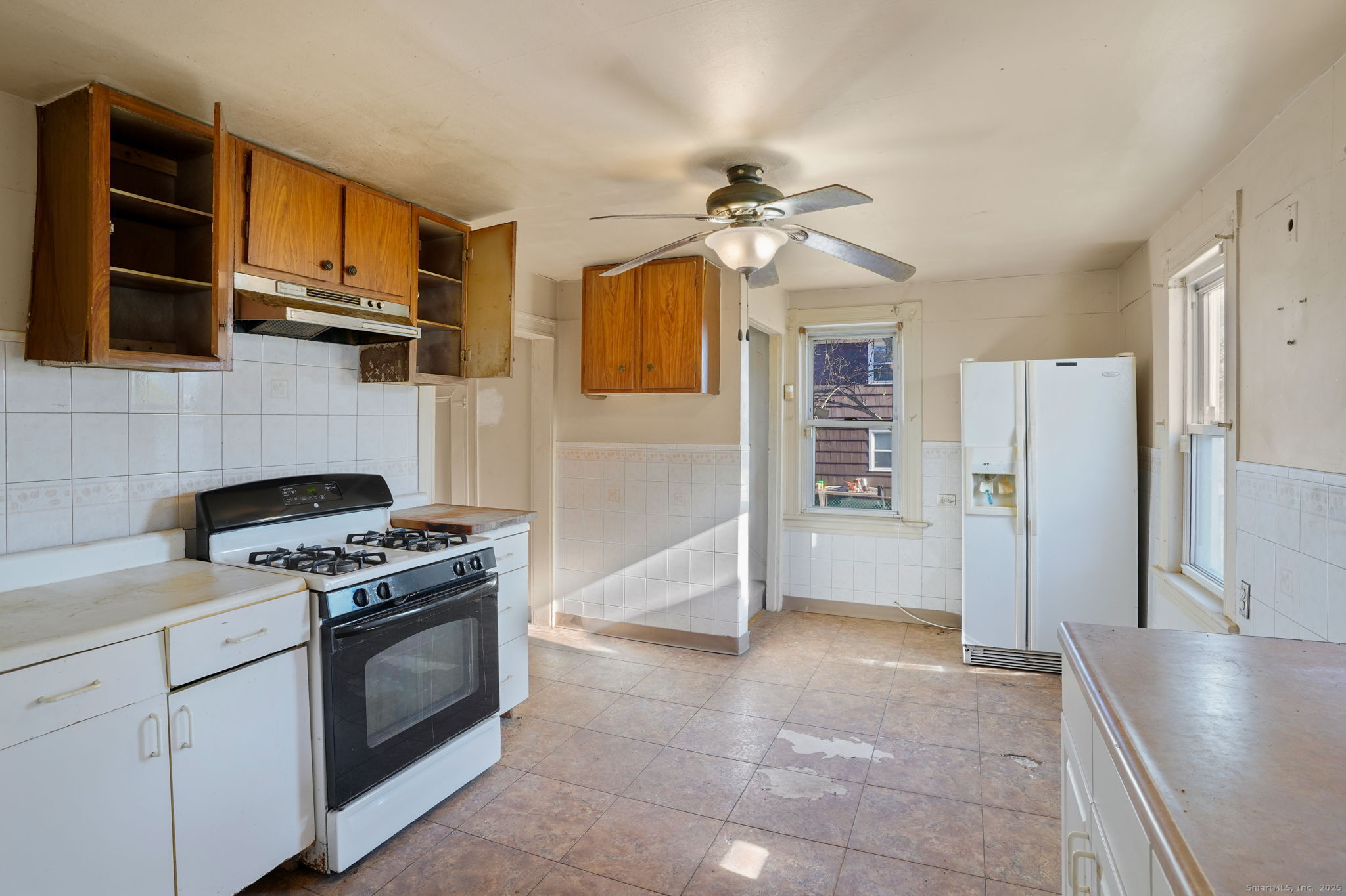 73 Carlson Avenue Bridgeport, CT 06606 - Photo 6 of 29 a kitchen with stainless steel appliances granite countertop a stove cabinets and refrigerator