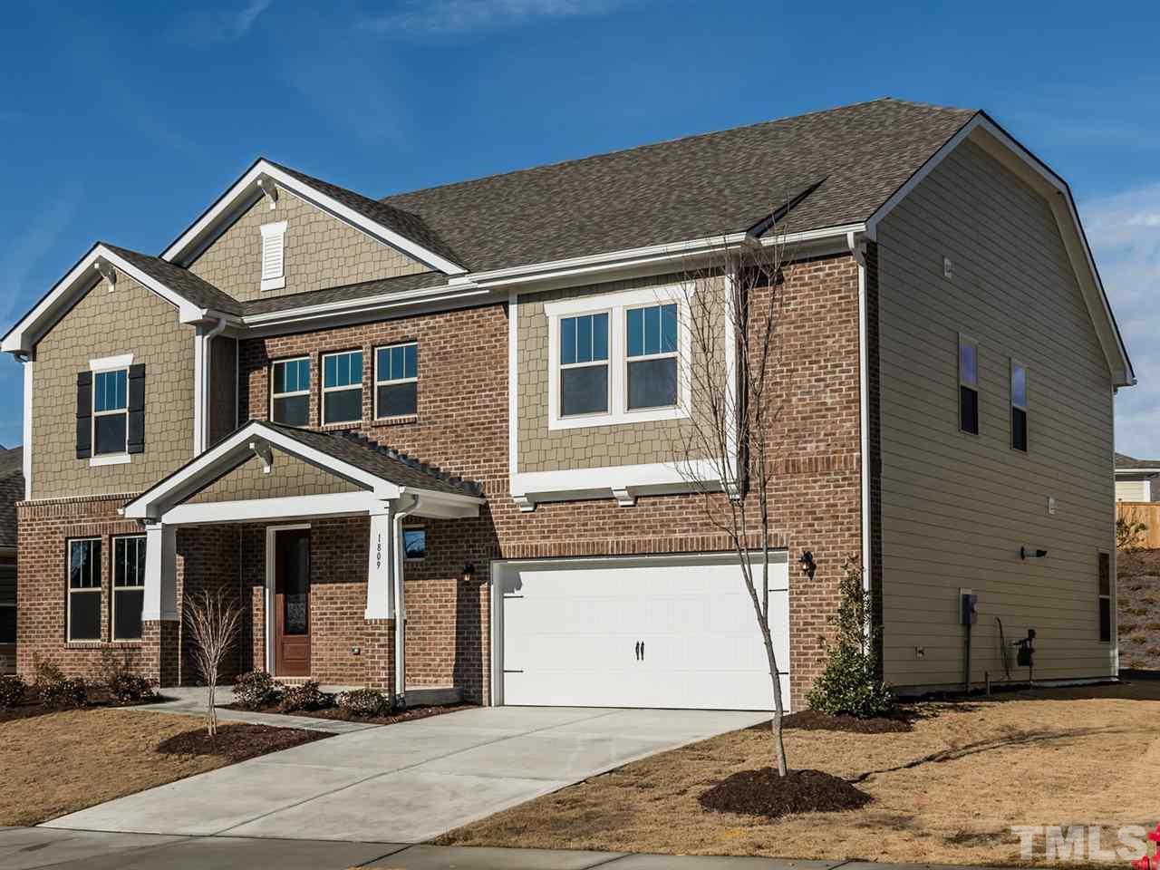 1809 Capstone Drive Durham, NC 27713 - Photo 2 of 25 a front view of a house with a yard