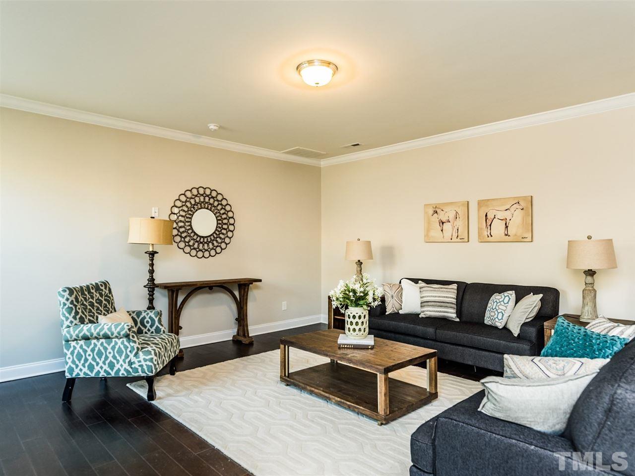 1809 Capstone Drive Durham, NC 27713 - Photo 15 of 25 a living room with furniture and a table