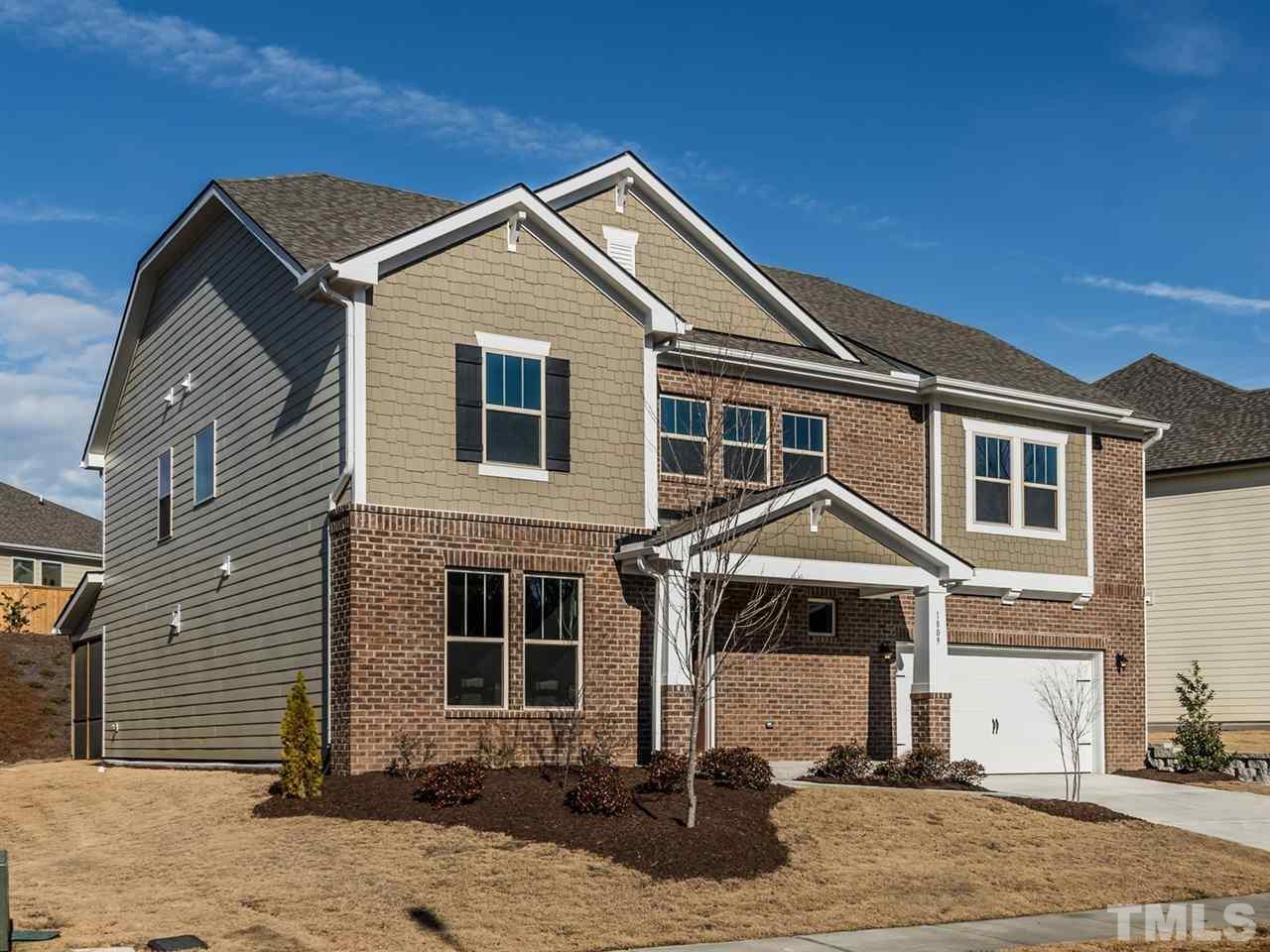 1809 Capstone Drive Durham, NC 27713 - Photo 3 of 25 a front view of a house with a yard