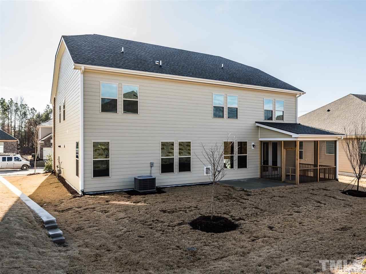 1809 Capstone Drive Durham, NC 27713 - Photo 23 of 25 a front view of a house with a yard