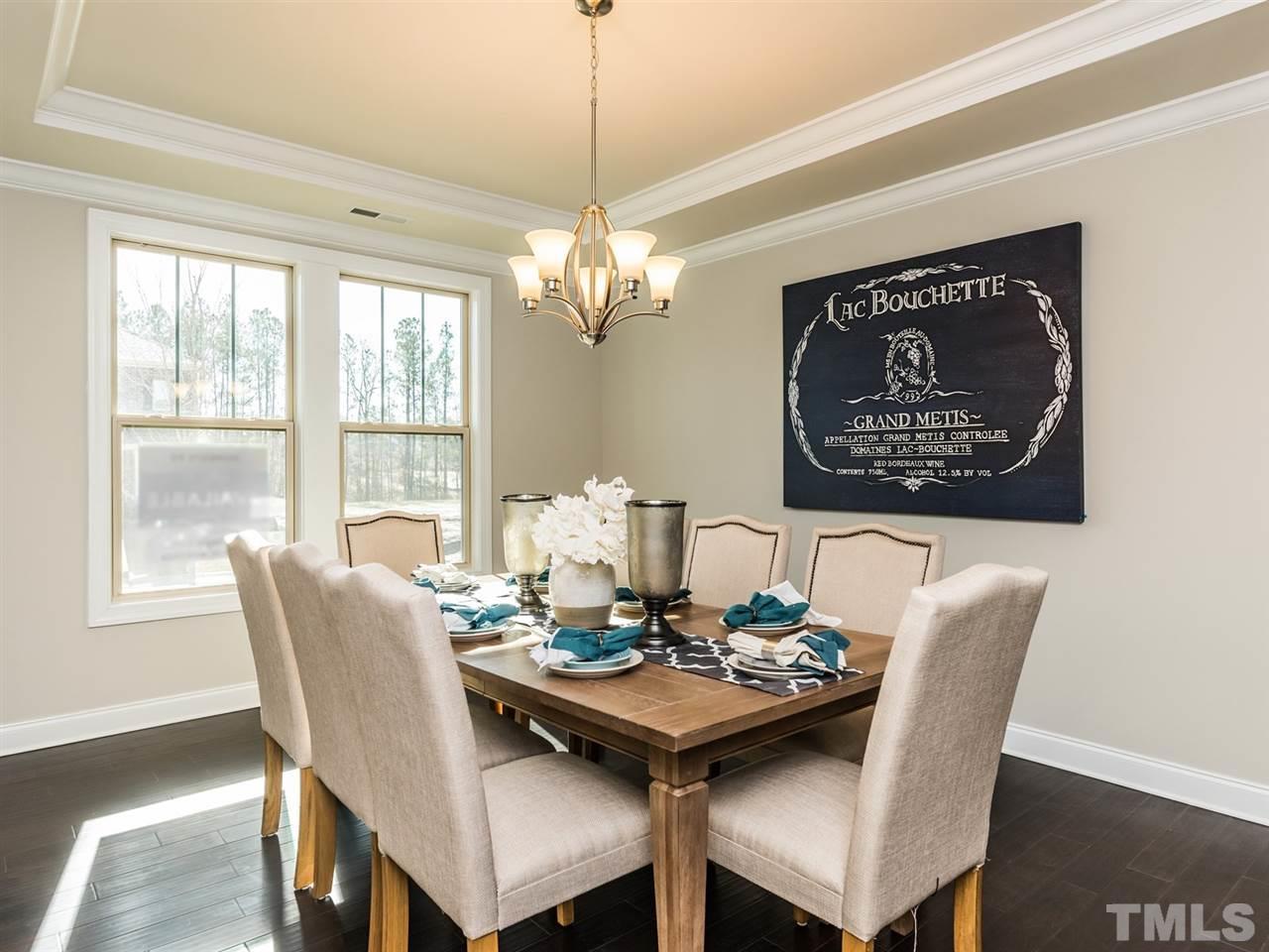 1809 Capstone Drive Durham, NC 27713 - Photo 6 of 25 a view of a dining room with furniture window and outside view