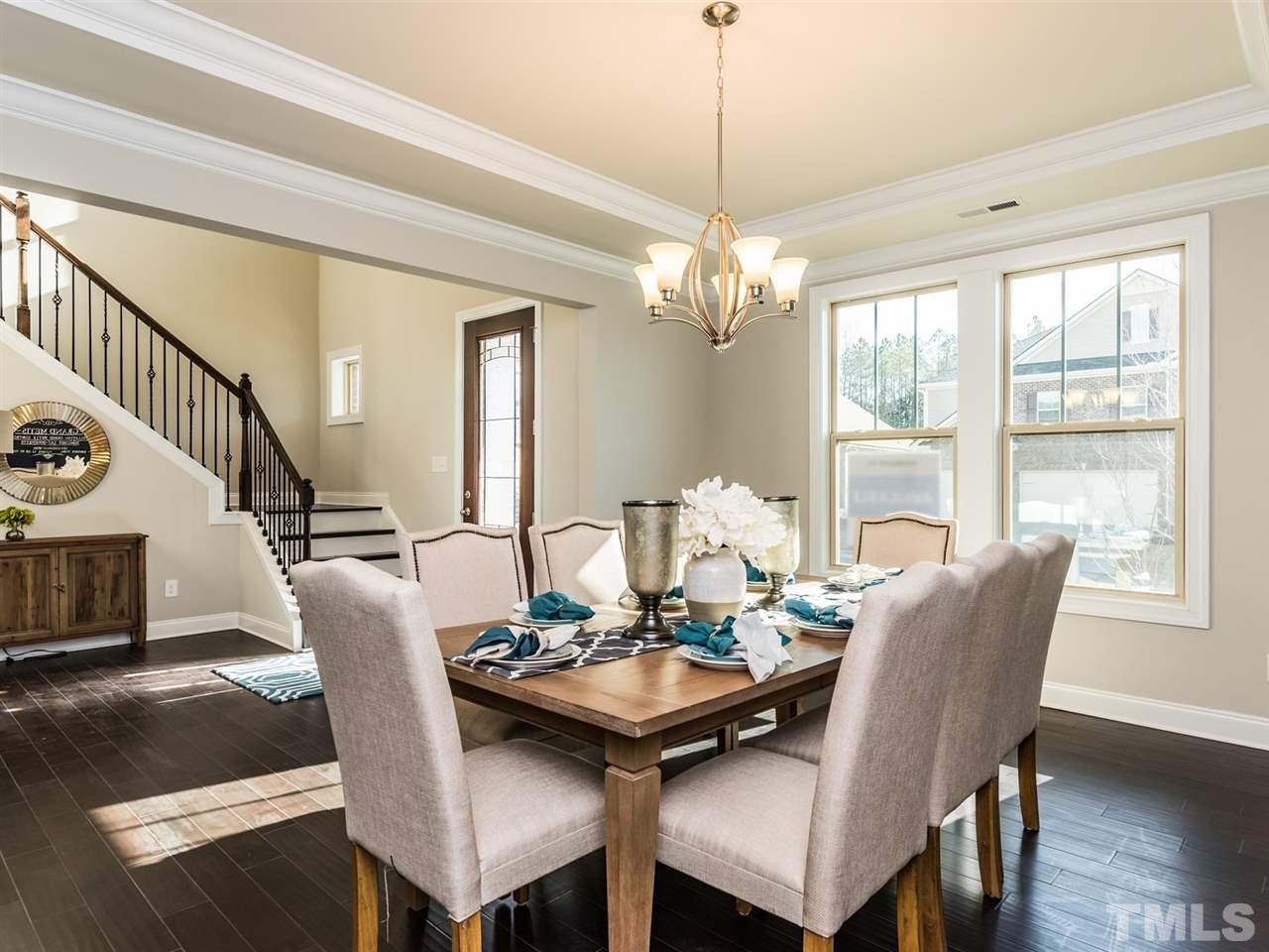 1809 Capstone Drive Durham, NC 27713 - Photo 7 of 25 a view of a dining room with furniture window and wooden floor